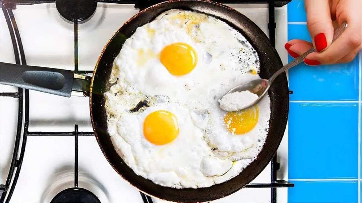 Why is it essential to add flour to the pan before frying the eggs? It changes everything